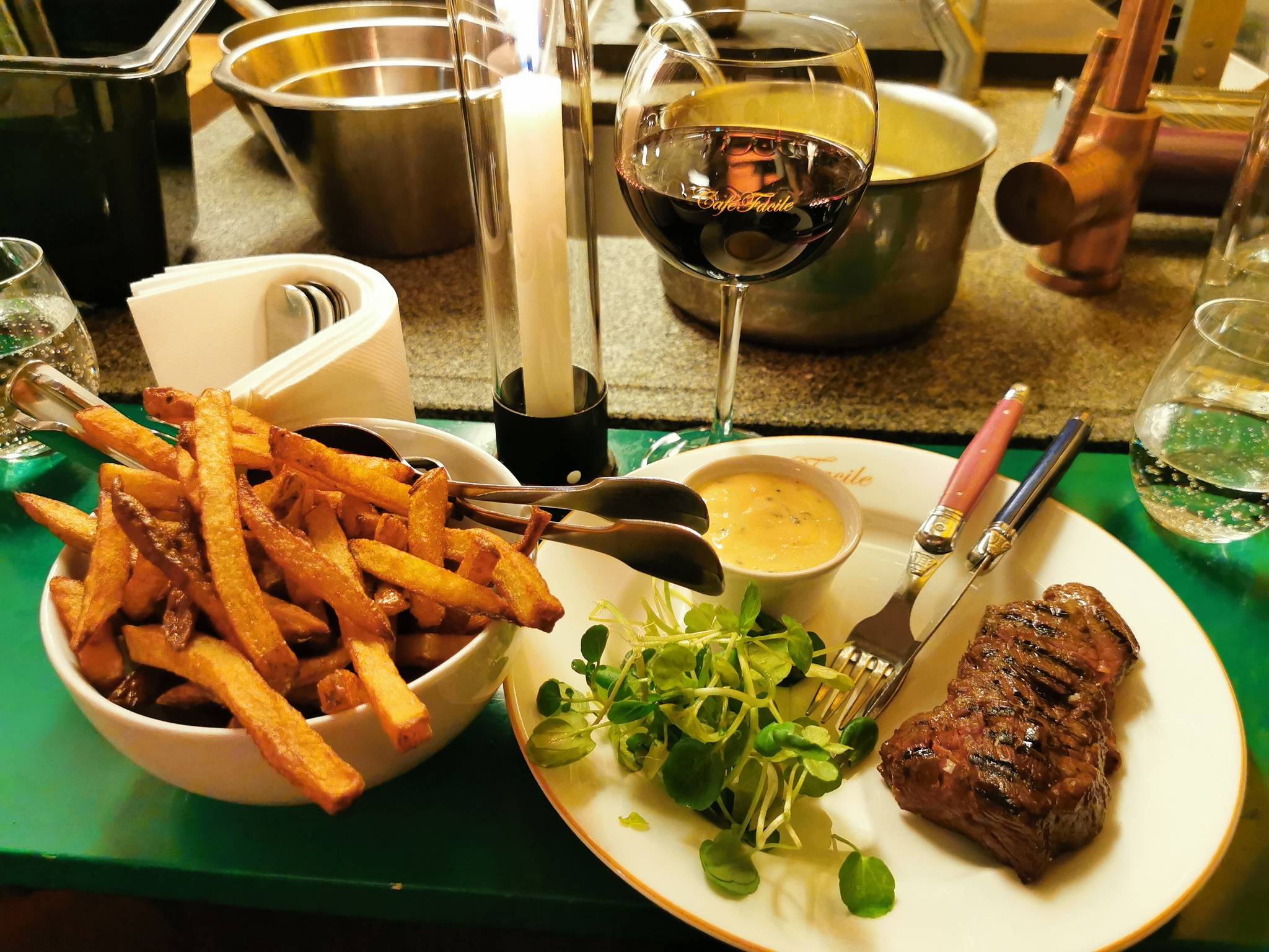 Main course Steak frites on butchers steak with béarnaise sauce and watercress. 