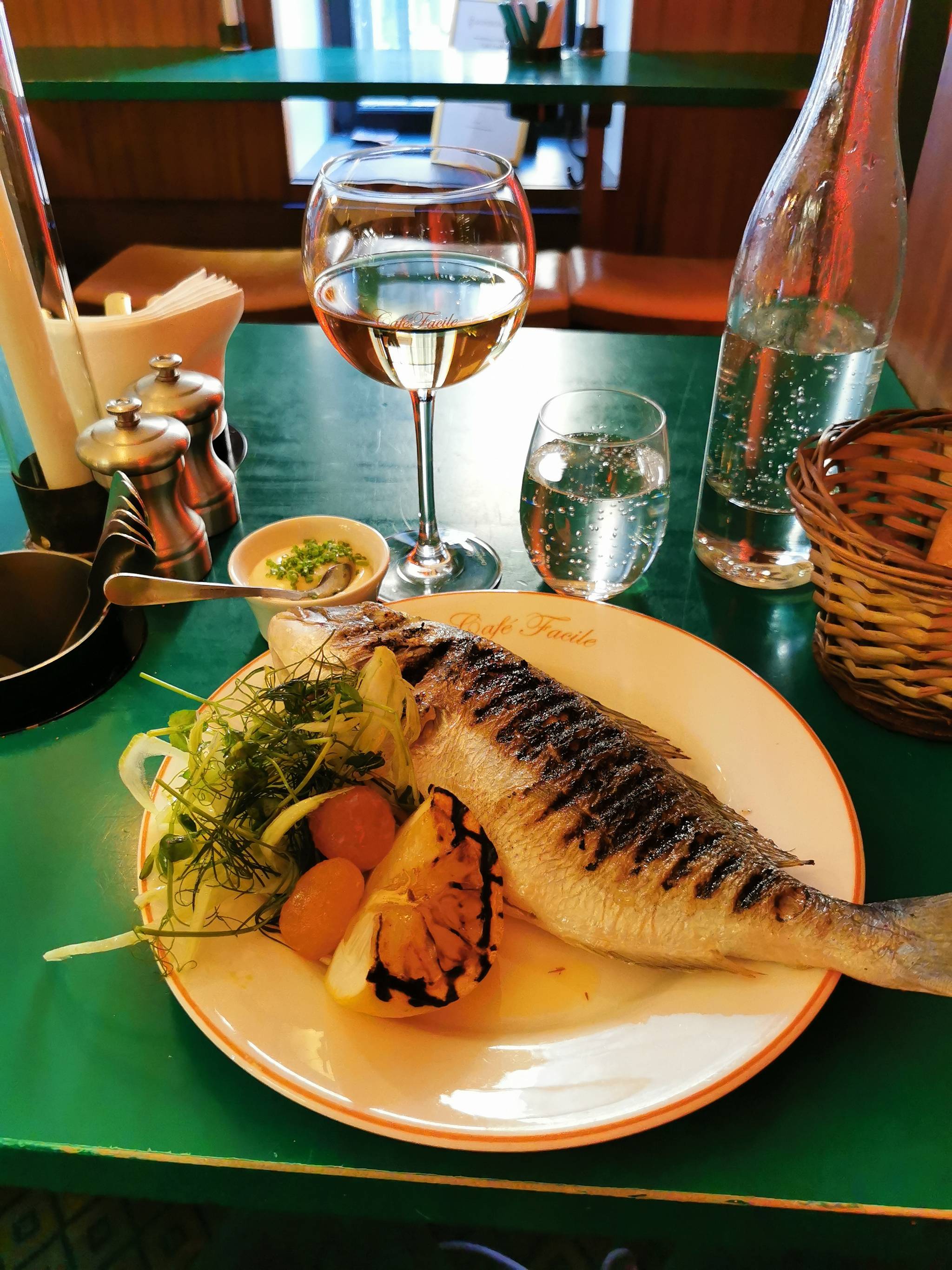Main course Grilled whole sea bream with fennel salad, aioli and grilled lemon. 